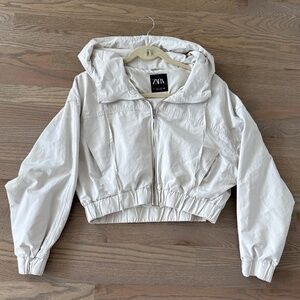 Zara cropped hooded jacket in a light beige or tan color  Size L